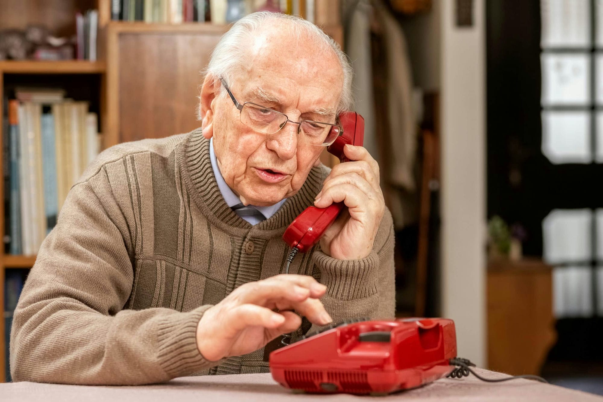 Grandfather with,old,red,button telephone landline phone