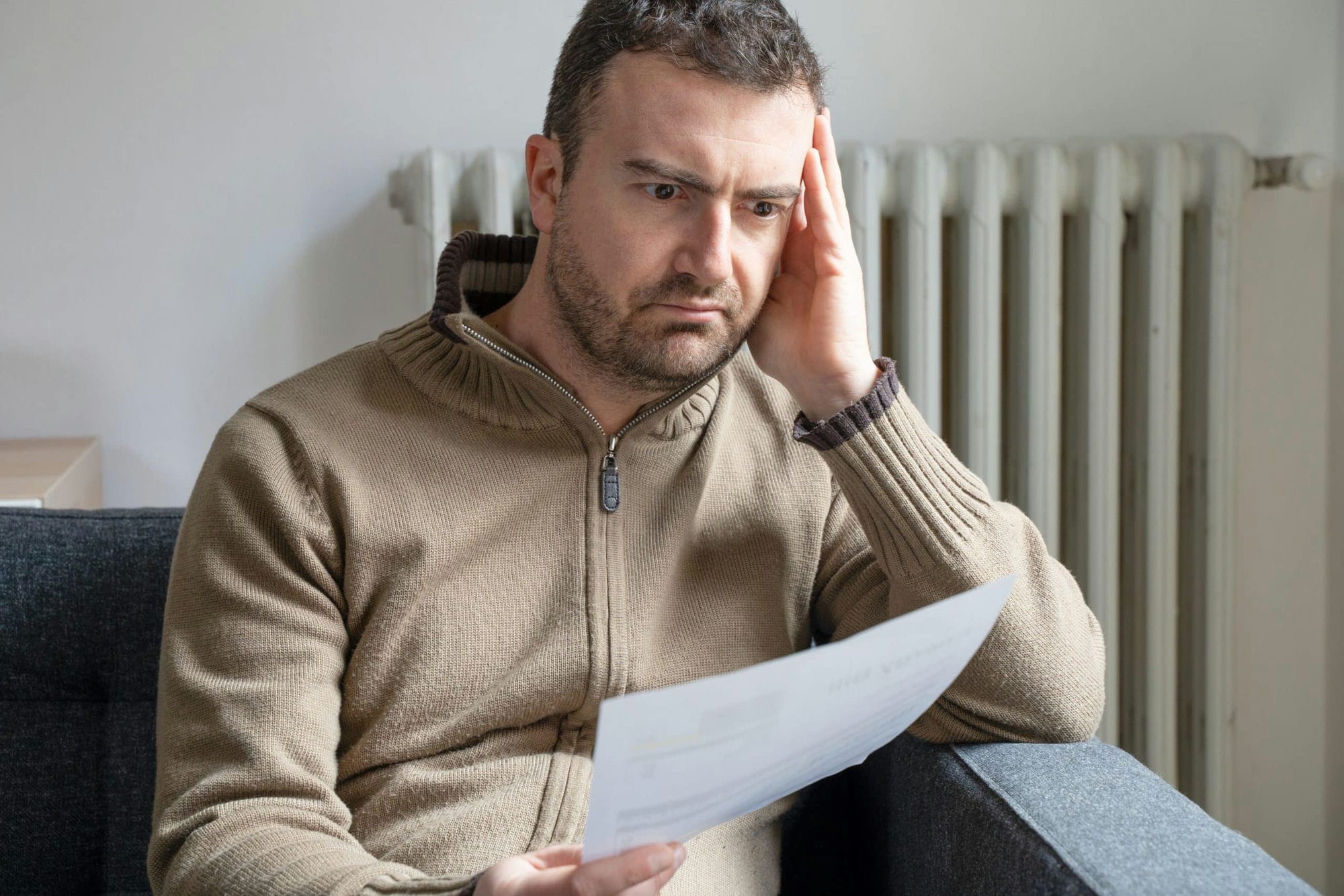 One Man Worried About Bills Reading Energy Increase Costs