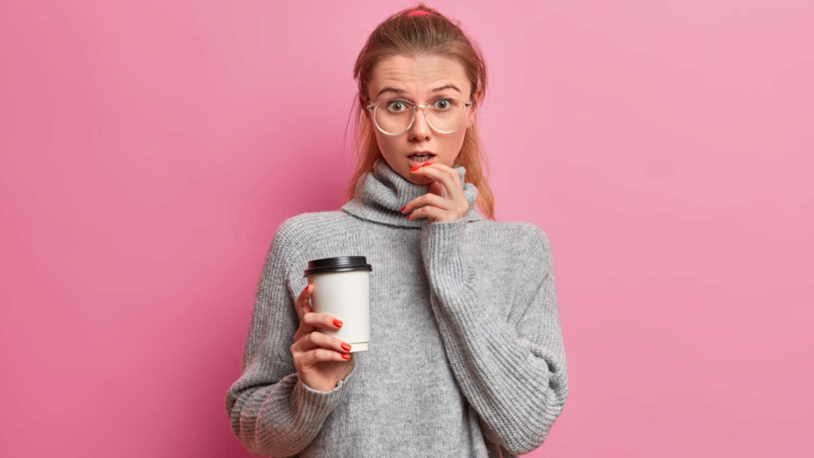 Shocked Young Woman With Coffee