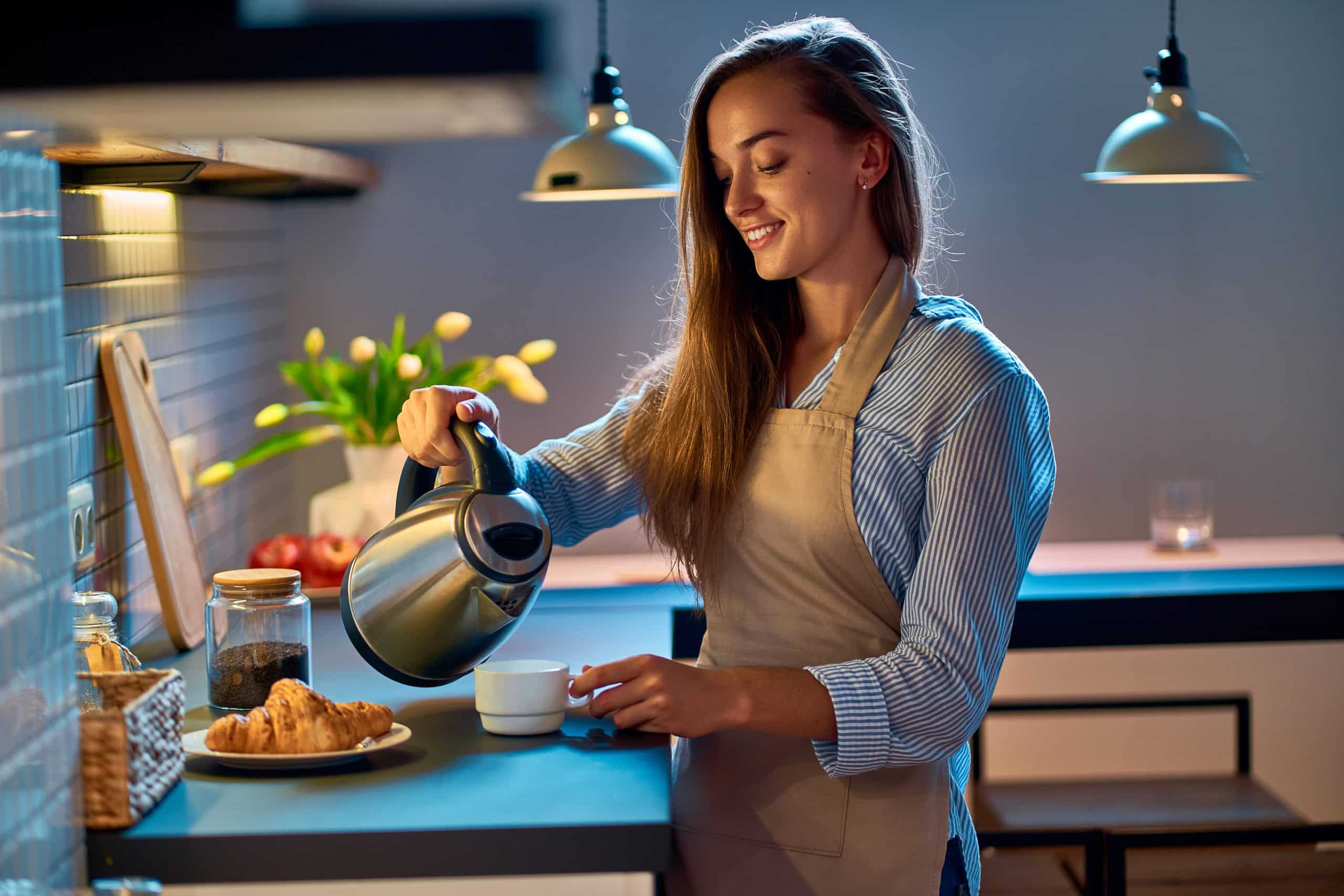 Happy Smiling Attractive Young Woman Housewife Pouring And Making Tea